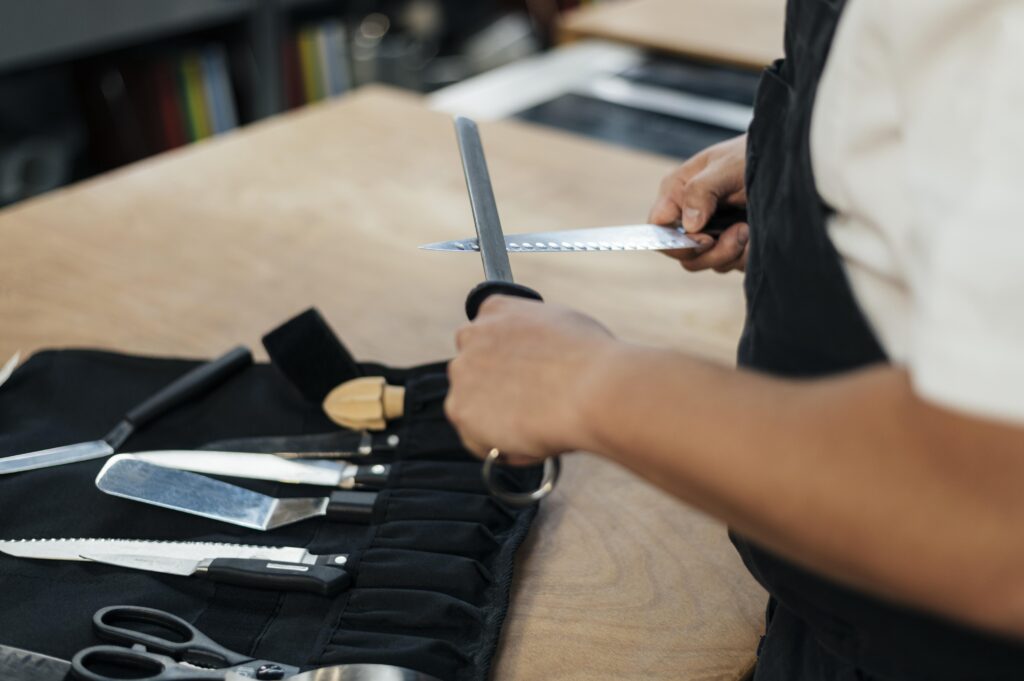 male-chef-sharpening-his-knives-1024x681